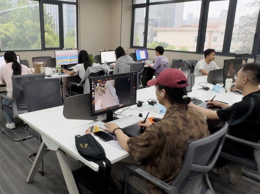 Tiansun designers sculpting 3D figurine models at their workstations